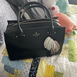 Black Kate spade shoulder bag with pink tassels